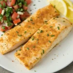 Quick and flavorful Swai fish fillets seasoned with garlic powder, paprika, salt, and pepper, cooked to perfection.