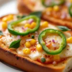 Pizza toast 2 Two golden, crispy pizza toasts topped with melted mozzarella